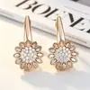 Pendientes Huecos Exquisitos de Cobre Incrustado con Circonita de Girasol Deslumbrante Yanbai Estilo Europeo y Americano Floral Versátiles de Gama Alta