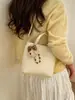 Bolso de Cubo de Estilo Coreano de Nicho Transfronterizo para Mujer Primavera 2026 Nuevo Bolso de Hombro Cruzado Casual Elegante de Gama Alta