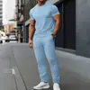 Conjunto de verão novo estilo europeu e americano para homens, casual, jacquard, cor sólida, para esportes ao ar livre, com camisa de manga curta e calça comprida
