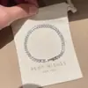 Pulsera de circonita multicolor de lujo ligero para comercio exterior europeo y americano, deslumbrante con incrustaciones de diamantes, a la moda, simple, elegante, joyería de alta gama al por mayor