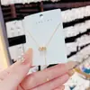 Colar de borla de cintura de homem pequeno de alta qualidade Corrente de clavícula feminina Nova entrada de luxo Niche Design Sense Exquisite Colar Acessórios de corrente
