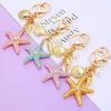 Llavero de Estrella de Mar de Diamante Europeo y Americano para Coche Colgante de Bolso de Metal para Mujer Anillo de Llavero Oceánico Regalo de Negocio Transfronterizo