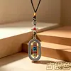 Joia de liga metálica estilo étnico chinês, pingente decorativo de vajra oval giratório, lembrança de viagem atacado