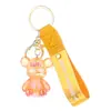 Llavero de oso luminoso de acrílico de gelatina de moda roja, lindo colgante para mochila de pareja, regalo pequeño para máquina de garra, venta al por mayor