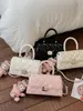Bolso de hombro cruzado para mujer con cadena de rombos transfronteriza, diseño de nicho nuevo para el verano de 2026, bolso de mano pequeño cuadrado con sensación de alta gama