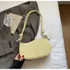 Bolsa Pequena Feminina Verão 2025 Nova Bolsa de Ombro Versátil Estilo Estrangeiro Alta Qualidade para o Dia a Dia Bolsa Transversal de Braço