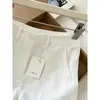 Shorts blancos de lino de corte ajustado que alargan las piernas, estilo "old money", para mujeres petite