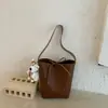 Bolso Pequeño Versátil de Alta Gama para Cruce de Fronteras de Gran Capacidad Estilo Nuevo Primavera 2026 Bolso de Hombro Único para Debajo del Brazo de Mujer Bolso Cubo