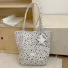 Bolso de mujer de gran capacidad, nuevo bolso de hombro de moda versátil otoño 2026, versión coreana bolsa de mano casual con estrellas