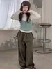 Conjunto de otoño para niña 2026 nuevo estilo: top de punto tipo camisola con falda acampanada y pantalones de pierna ancha, conjunto infantil en capas estilo coreano