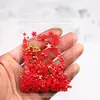 Arte de uñas flor de cinco pétalos joyería flor blanca pequeña bolsa mixta de tamaño de cuentas doradas y plateadas decoración de pegatina de uña de flor de resina venta al por mayor