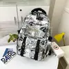 2026 Mochila Nueva de Estilo Coreano Estilo Bosque Moda Tendencia Personalidad Genial Versátil Graffiti Gran Capacidad para Estudiantes Universitarios