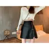Falda Corta Mini A-Line de Cuero PU Adelgazante de Chica Popular Cintura Alta para Mujer Primavera/Otoño Nueva Moda Cremallera Abertura Falda Midi Petite