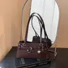 Bolsa de ombro estilo baguette, casual coreano, design de nicho para axila feminina, nova coleção outono 2026, moderna e versátil