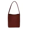 Bolso de mujer de alta gama 2026 nuevo de moda verano nicho patrón tejido bolso de hombro bolso cubo para ir al trabajo bolso de axila