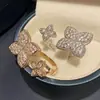 Anel Flor de Quatro Folhas Cravejado com Diamantes Brilhantes Novo Estilo Venda por Atacado Design de Nicho Luxo Leve High-End Ajustável Anel Aberto para Mulheres