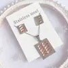 Nuevo especial transfronterizo explosión de tendencia europea y americana titanio acero alta calidad color collar pendientes traje femenino joyería de concha real
