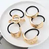 Estilo punk europeo y americano metal personalidad alta calidad cuerda para la cabeza semicírculo tubo redondo anillo para el pelo cuerda elástica para el pelo Balot fabricantes al por mayor