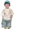 Camiseta de Manga Corta para Niños Ropa de Verano para Niños 2026 Nuevo Delgado Blanco con Letras Cuello Redondo Conjunto de Shorts de Mezclilla