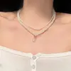 Colar Francês Retro de Pérolas com Dupla Camada e Pequenos Acessórios de Miçangas de Arroz para Mulheres, Gargantilha de Luxo de Alta Qualidade, Corrente de Clavícula de Nicho para Mulheres