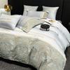 Ropa de cama europea de fábrica de alta gama de lujo ligero 60 algodón australiano suave para la piel cuatro piezas funda de edredón bordada en relieve sábana gorro de cama