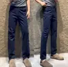 Pantalones casuales de otoño para hombre, de color liso, sencillos y elegantes, con una personalidad única, versátiles para negocios, con un tacto de alta gama y un corte ligeramente ajustado