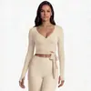 Conjunto de pantalones de yoga europeos y americanos transfronterizos con manga larga de color liso, amigable con la piel, transpirable, hermoso diseño en la espalda, ajuste ceñido, pantalones de fitness adelgazantes