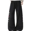 Pantalones retro bordados estilo tie-dye americano, diseño unisex con corte inclinado, dobladillo curvo y un ambiente único y de nicho, perfectos como pantalones largos deportivos y modernos