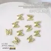 Accesorios para arte de uñas: mariposas de metal en dorado, plateado y blanco K, corbatas de moño, cintas tridimensionales estilo japonés, accesorios de decoración de uñas de mariposa