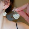 Pendientes de borlas con perlas y flores de plata con alfileres, elegantes, ligeros y de lujo, para mujer, de alta gama.