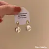 Pendientes para hombre con forma de estrella de amor cepillada esmerilada 2025 nuevo popular de lujo ligero alta gama pendientes con clip para oreja femenino nicho único