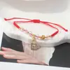 Pulsera de Cuerda Roja con Amuletos de Trébol, Mariposa y Cristales, Pulsera Tejida Ajustable para Parejas y Estudiantes, Joyería de Año de Nacimiento