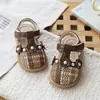 Sandalias tejidas caladas con lazo de encaje para niña 2026 Verano Punta cerrada Sandalias de princesa con perlas Zapatos de playa Modernas