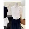 Suéter de punto trenzado para mujer con cuello polo estilo universitario, de manga corta, adelgazante y único, de longitud corta, nuevo top de moda para el verano de 2025