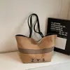 Bolsa de Lona de Gran Capacidad para Mujer 2025 Nueva Casual Coreana de Nicho Versátil Bolso de Hombro para el Trabajo y Bolsa para Ropa de Trabajo