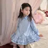 Vestido de Niña Otoño 2026 Nuevo Elegante Vestido Camisa Infantil Moda Falda Estilo Escolar para Bebé Versión Coreana