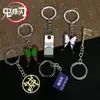 Llavero colgante de aleación de metal con diseño de mariposa Zhilang You Bean de Anime Ghost Extermination Blade que rodea el carbón. Comercio exterior.