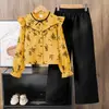 Conjunto para Niñas Comercio Exterior Ropa Infantil 2026 Primavera Nueva Moda Camisa de Manga Larga con Estampado de Encaje y Pantalones de Pierna Ancha Conjunto de Dos Piezas