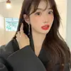 Nuevos pendientes de botón de plata S925 con forma de lazo para mujer, diseño de nicho de moda, clip para la oreja con cadena, joyería simple versátil, venta al por mayor