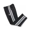Pantalones bordados de mariposa transfronterizos con franjas laterales en blanco y negro, pantalones deportivos casuales unisex, estilo pareja universitaria al por mayor