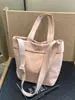 Bolsa Casual Popular Transfronteiriça de Grande Capacidade para Mulheres 2026 Nova Bolsa Leve para o Dia a Dia Bolsa Tote Versátil de Cor Sólida