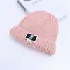 Gorro de punto para niños, engrosado con hilo grueso para otoño e invierno, con una etiqueta de tela de dibujos animados, diseño unisex y un estilo cálido para poner, adecuado para ventas transfronterizas