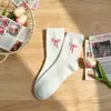Calcetines de felpa hasta la pantorrilla con jacquard de lazo, suaves y amigables con la piel, adecuados para el uso diario, lindos y modernos para niñas