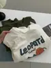 Camiseta Larga de Algodón Cepillado con Estampado de Dibujos Animados Lindos Estilo Coreano para Mujer 2026 Otoño Nueva Holgada Versátil Estilo Ins Superior