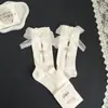 Novas meias de cano médio vazadas com strass e laço doce, meias da moda feminina, meias largas de celebridade da internet mais vendidas para primavera-verão