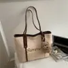 Bolso de Paja Tejida para Vacaciones en la Playa para Mujeres 2025 Nuevo Popular de Gran Capacidad Bolso de Hombro Moderno Bolso Tote de Moda para el Trabajo