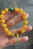 Pulseira de vidro imitação de ágata estilo nacional pingente pequeno retrô pulseira de cera de abelha mais vendida produtos explosivos para corrida Jianghu mercado matinal