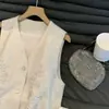 Elegante y versátil nuevo chaleco de estilo chino, nuevo modelo primavera 2026, chaleco exterior sin mangas con cuello en V de estilo nacional