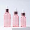 Botella cuentagotas redonda de oro rosa de varios tamaños, material de embalaje cosmético, botella de líquido, subembotellado rosa