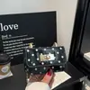 Bolso con Hebilla de Cierre para Mujer 2026 Nuevo Estilo Moda Tendencia Lunares Pequeño Bolso de Asa Superior Textura de Alta Calidad Elegante Bolso de Hombro Único Cruzado